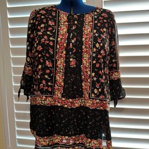 Black floral blouse, button up neck with tied sleeves